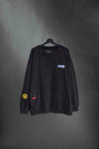 Buzo negro washed oversize con bordado Mushkana estilo cartel ruteros
