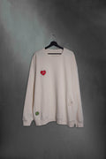 Buzo vainilla oversize con corazón Mushkana bordado en el pecho
