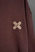 Detalle bordado rayo en manga de hoodie Rocky Road Healing